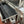 Add-On Skewer Kit displayed, showing the skewer, forks, bracket, and motor for large rotisserie models. Showing both 110v motors side by sde.